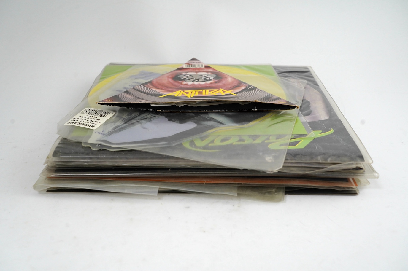 Twenty-one mainly 1990s heavy rock and heavy metal picture discs and coloured vinyl, bands including; Anthrax, Poison, Bon Jovi, Debbie Gibson, The Black Crowes, Quireboys, Thompson Twins, Iron Maiden, Electric Boys, etc